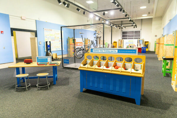 Assemble trolley with exhibit in background